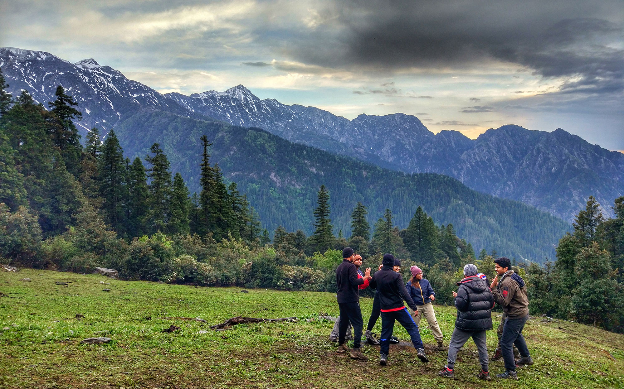 A group of travelers enjoying the view of mountains